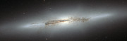 Hubble-opname van het sterrenstelsel NGC 4710 en zijn X-vormige bulge