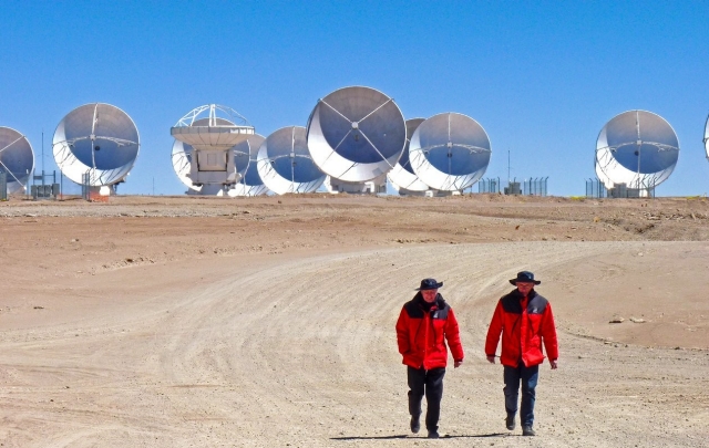 Men in red walk away from ALMA