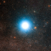 The bright star Alpha Centauri and its surroundings