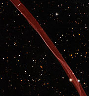 Část pozůstatku po explozi supernovy SN 1006 na snímku z kosmického dalekohledu HST