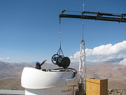 Structure of Test-Bed Telescope 2 is lowered into its dome