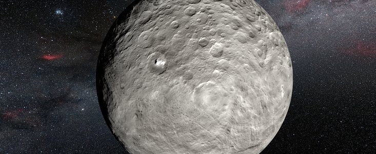 Představa jsných skvrn na povrchu trpasličí planety Ceres