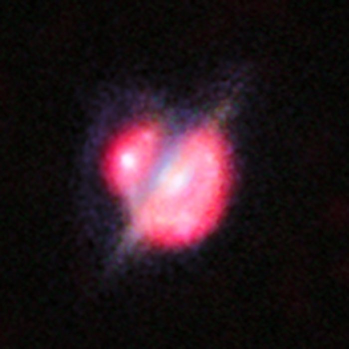Galaksesammenstød i det fjerne Univers, set igennem en gravitationslinse