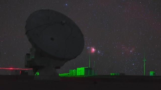 ALMA dish and the setting Orion Nebula