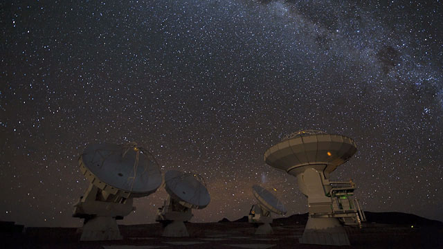 Four ALMA antennas on the Chajnantor plain