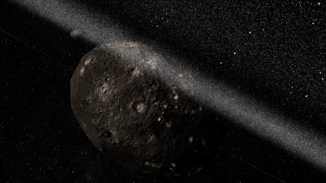 Taiteilijan näkemys asteroidi Charikloa kiertävästä rengasjärjestelmästä